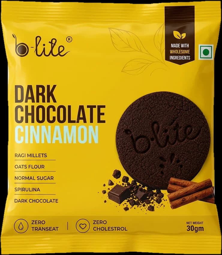A pack of B-lite Dark Chocolate Cinnamon cookies made with ragi millets, oats flour, spirulina and dark chocolate.